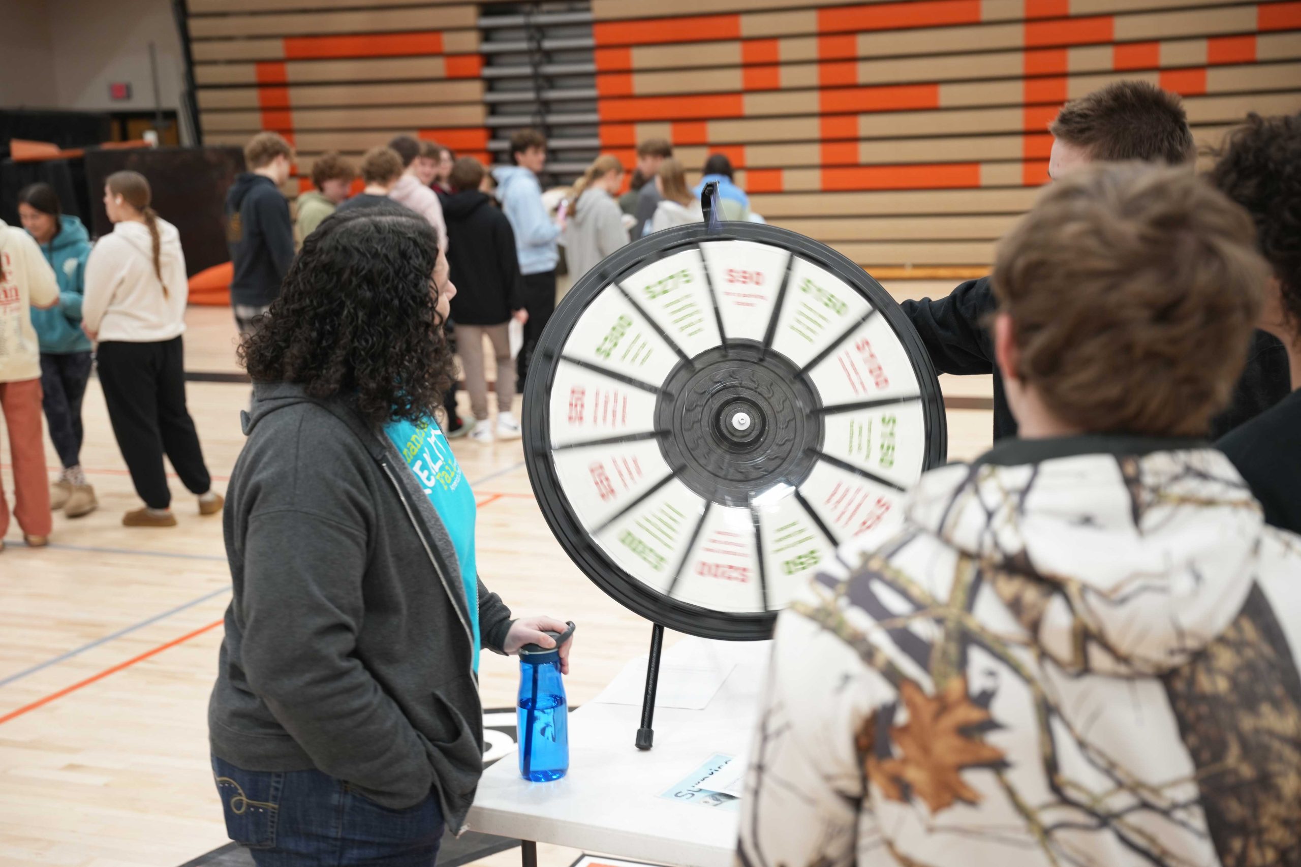 Students spin surprise wheel at Financial Reality Fair