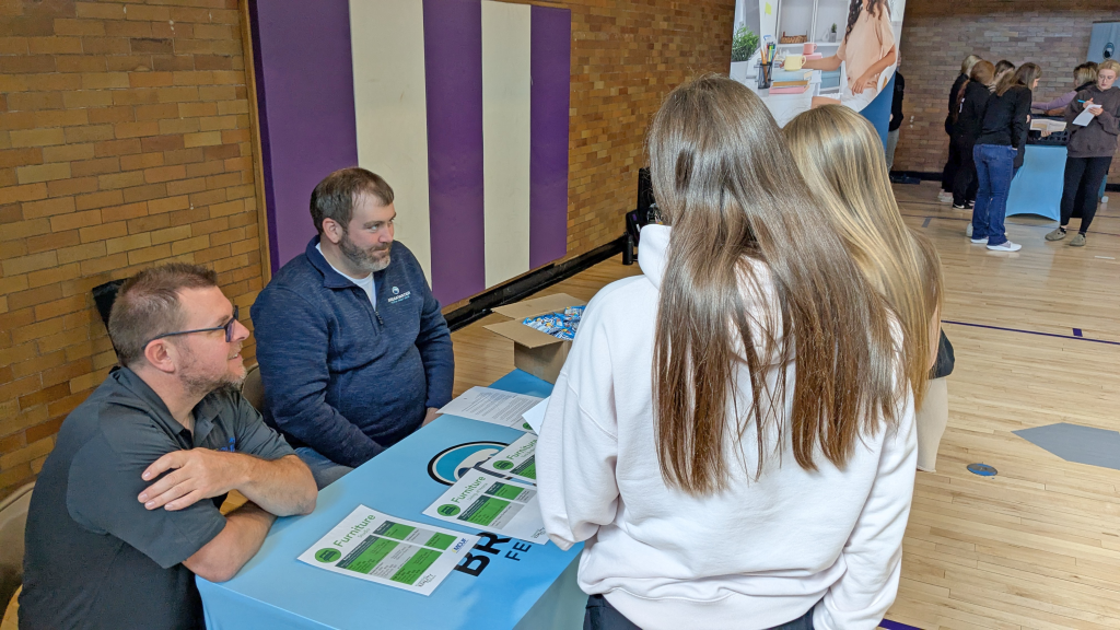 Students at furniture booth