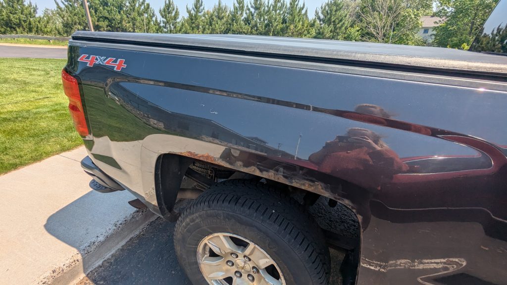 Picture of rust on rear wheel well