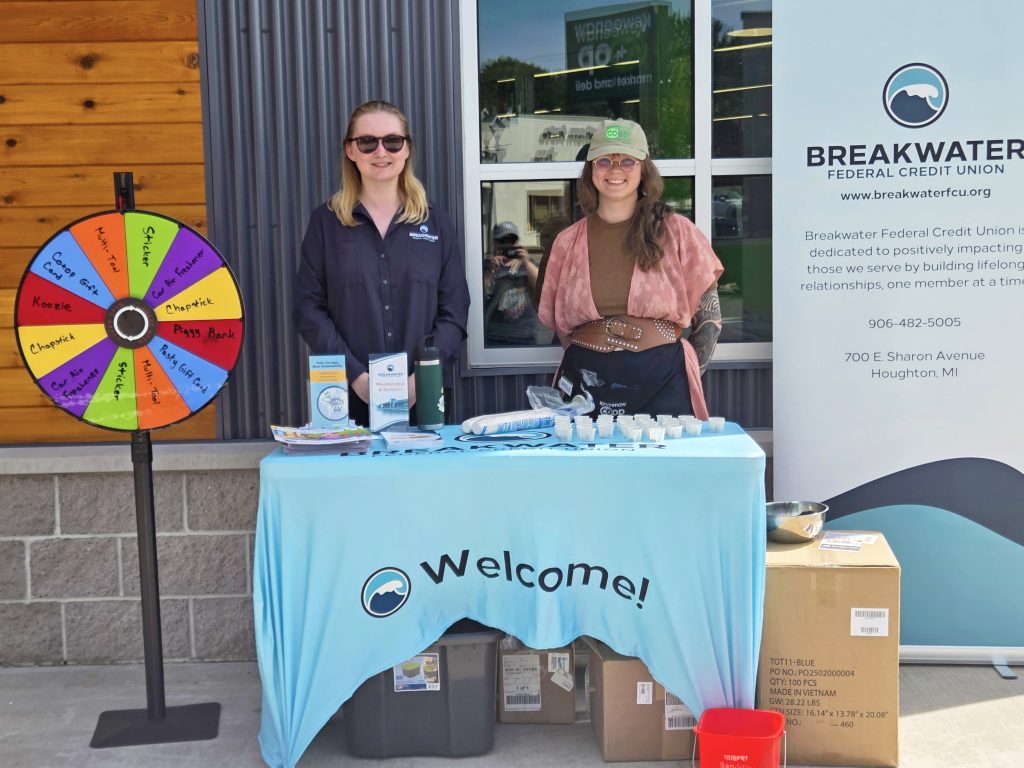Breakwater employee and Keweenaw Co-op Staff set up outside the Co-op to engage with community members and celebrate the International Year of Co-ops.