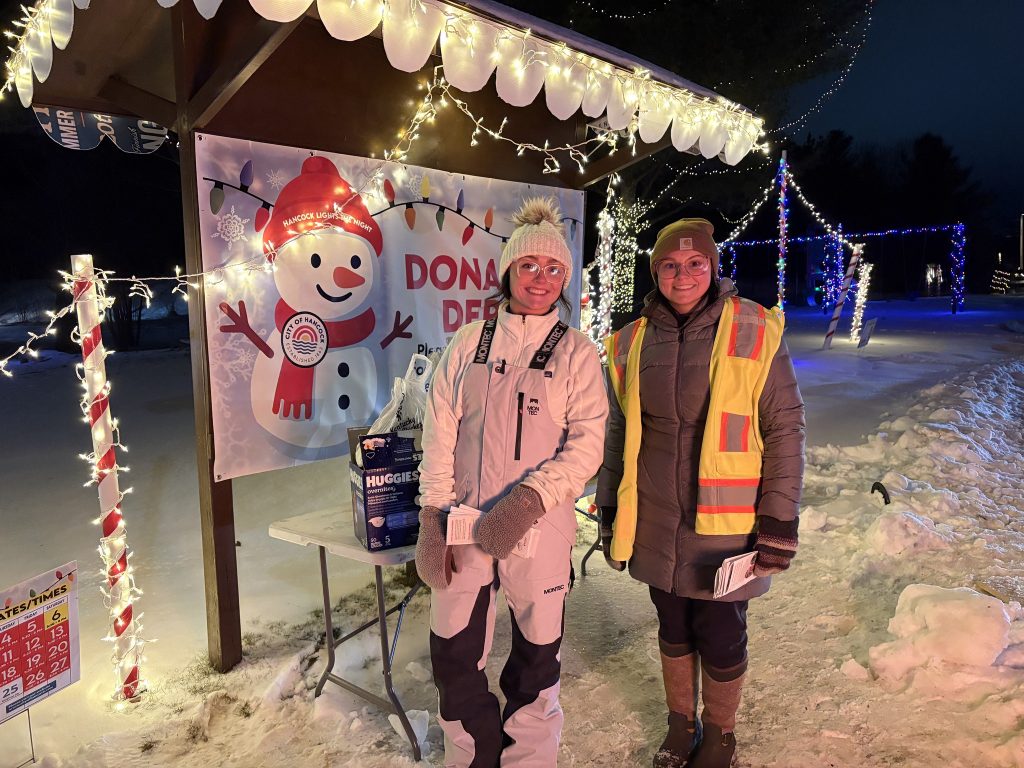 Breakwater employees pose for a photo at Hancock Lights the Night.