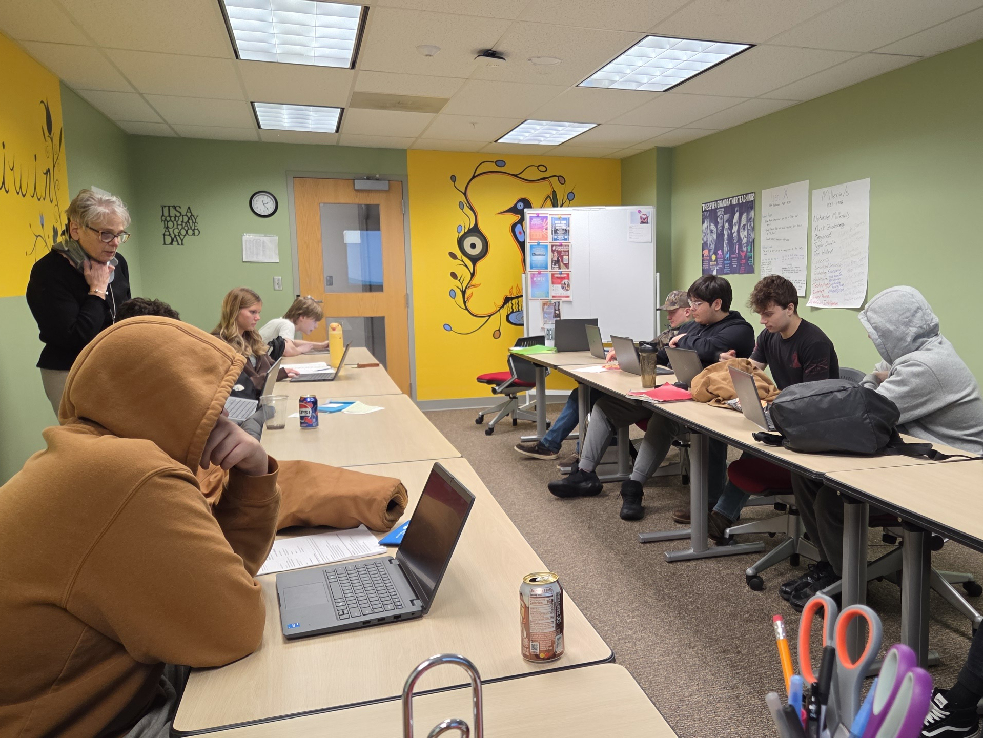 Business students in the CTE program work on press releases with guidance from Breakwater FCU.