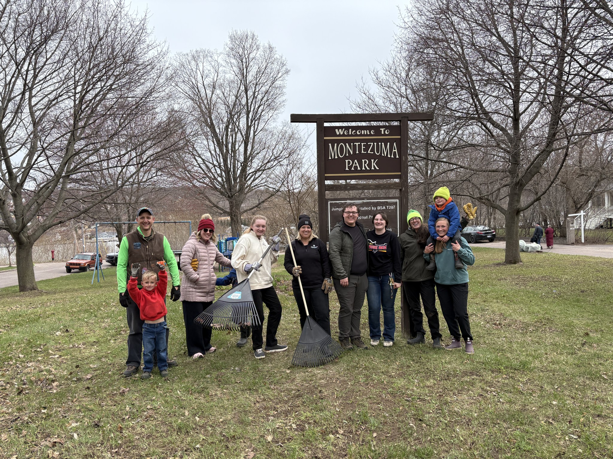 Breakwater employees and community volunteers cleaning up Montezuma Park during the annual spring cleanup in Hancock.