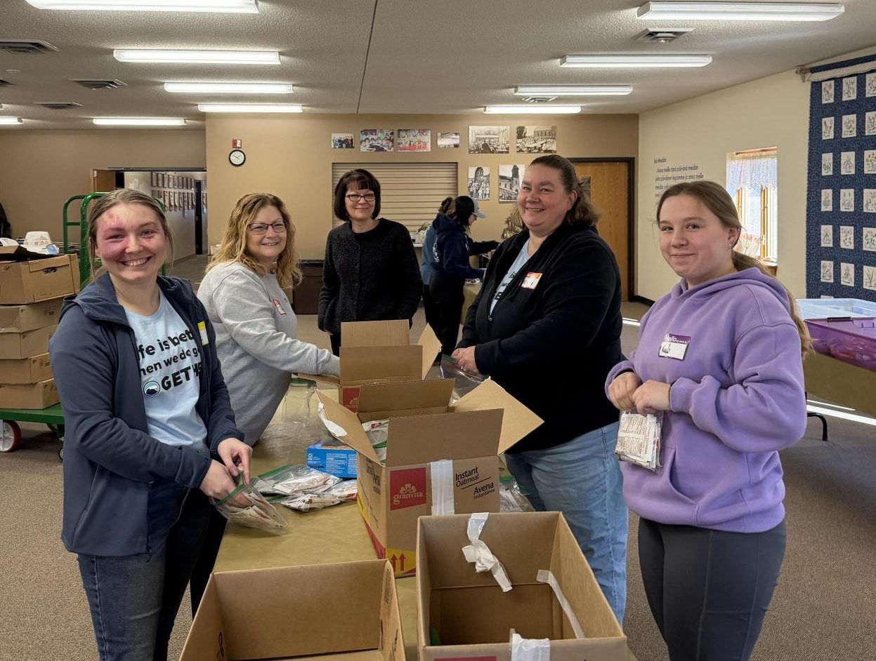 Employees Volunteering with 31 Backpacks