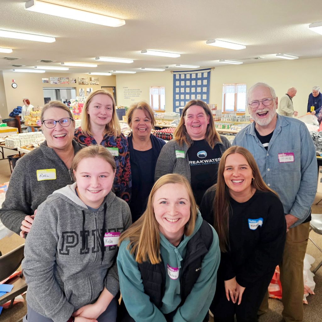 Breakwater FCU employees pose for a photo at volunteer event.